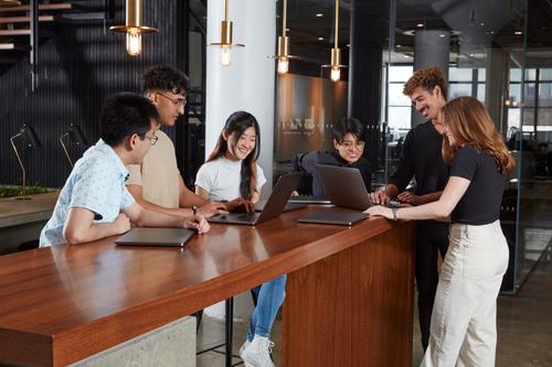 A group of people working together at a table.