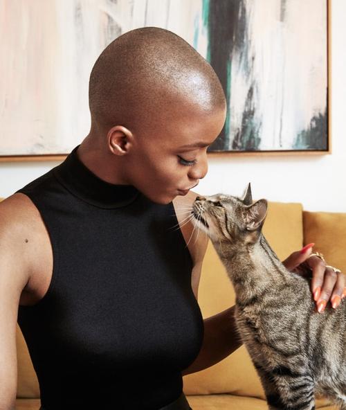 Adrienne kissing a cat