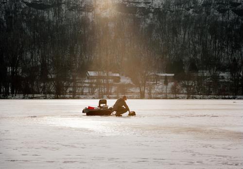 Man on icy lake